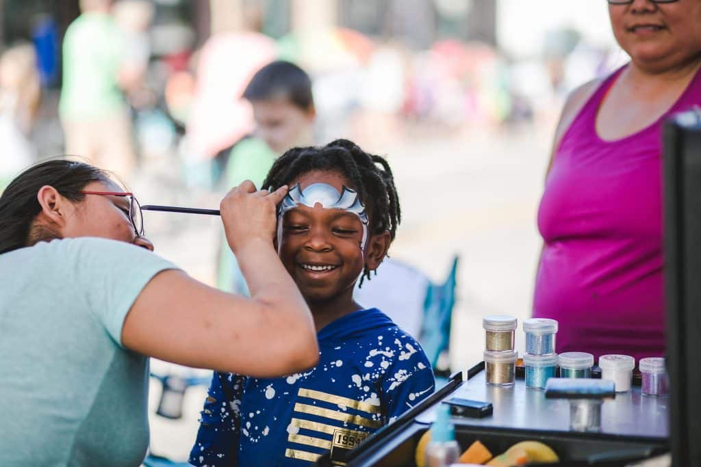 child getting face paint